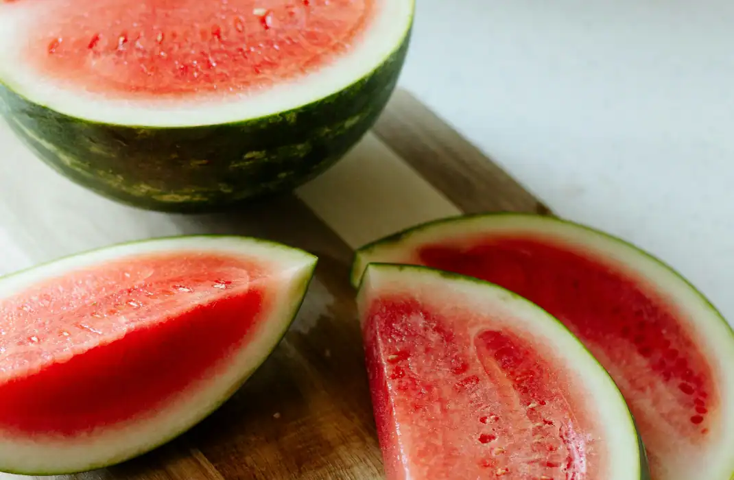 watermelon long side down and stem end covered by hat