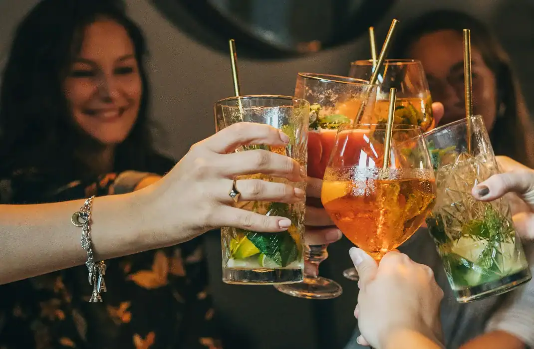 Bride squad keeping things casual and stress free as they toast their drinks.