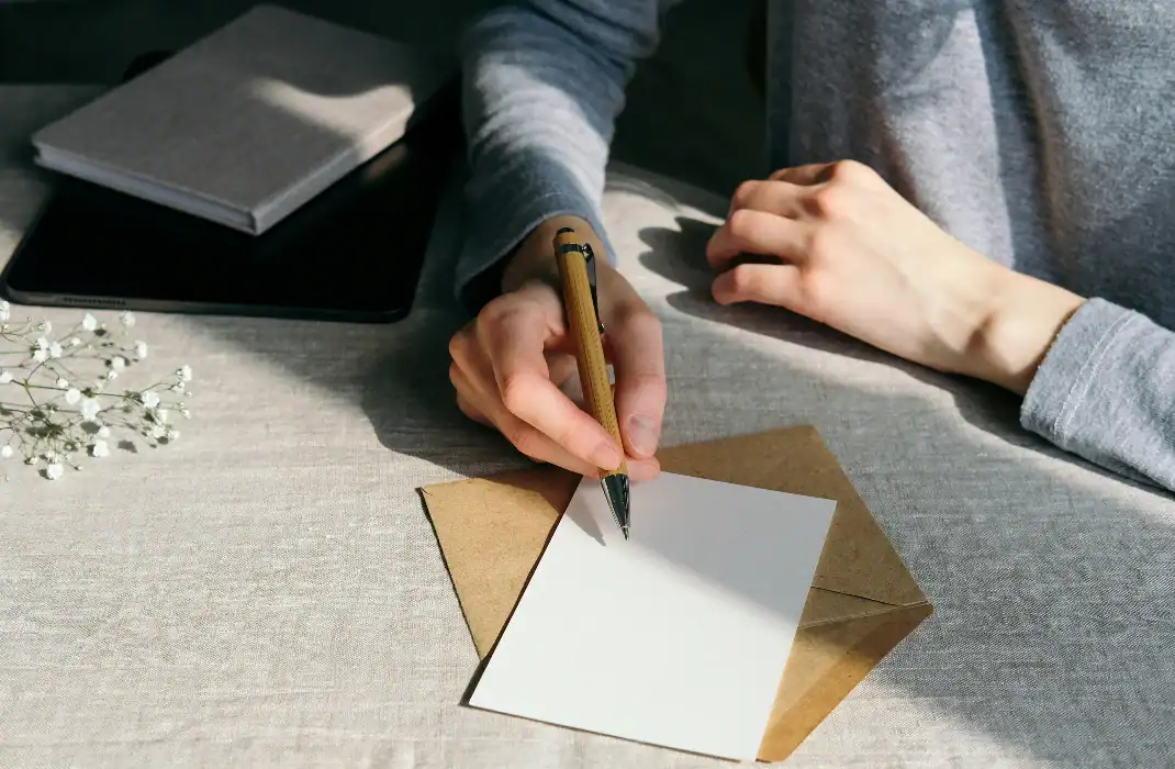 writing a heartfelt letter as an engagement gift
