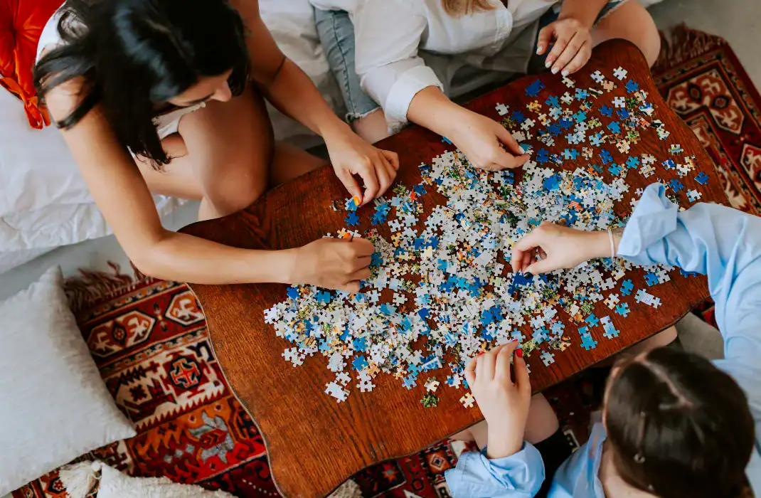 friends solving a large puzzle