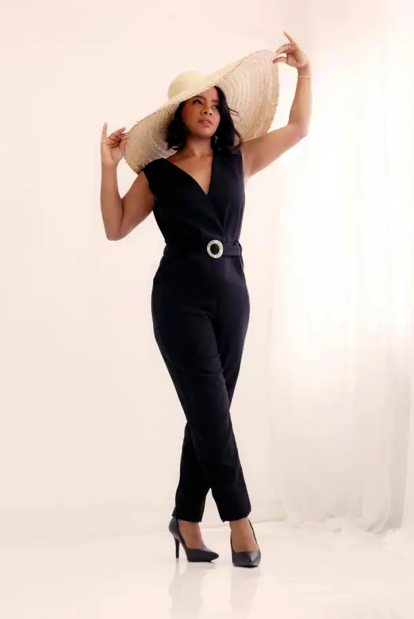 Woman in black jumpsuit perfect for engagement photo outfits