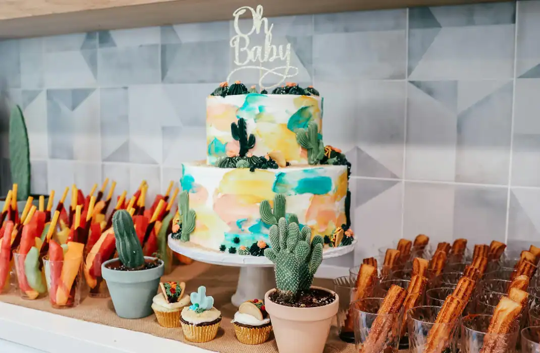 cactus-themed cake and snacks