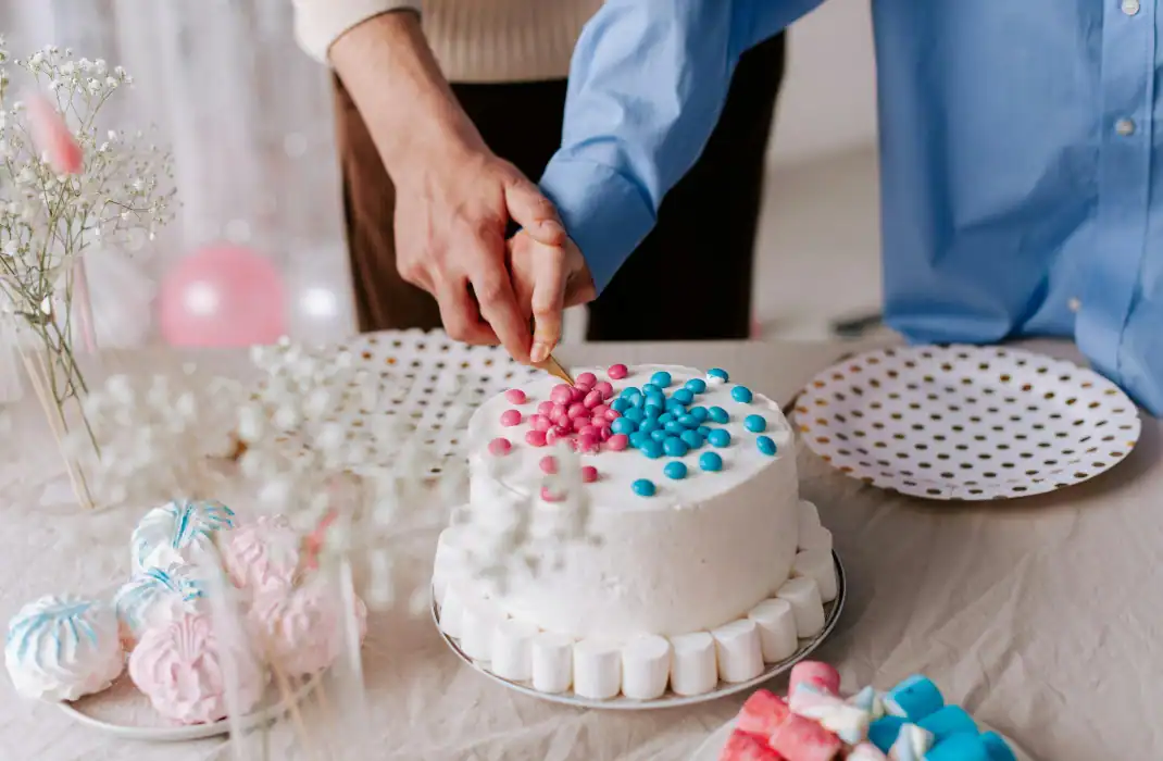 couple cutting into cake