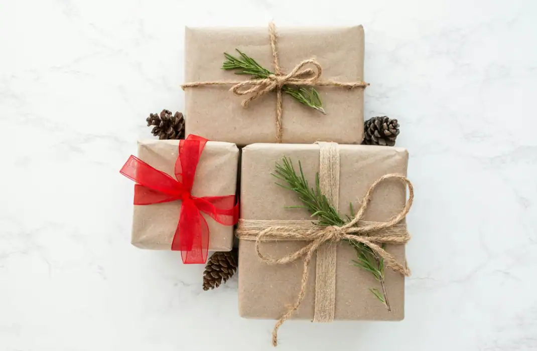 gifts wrapped in brown paper and string
