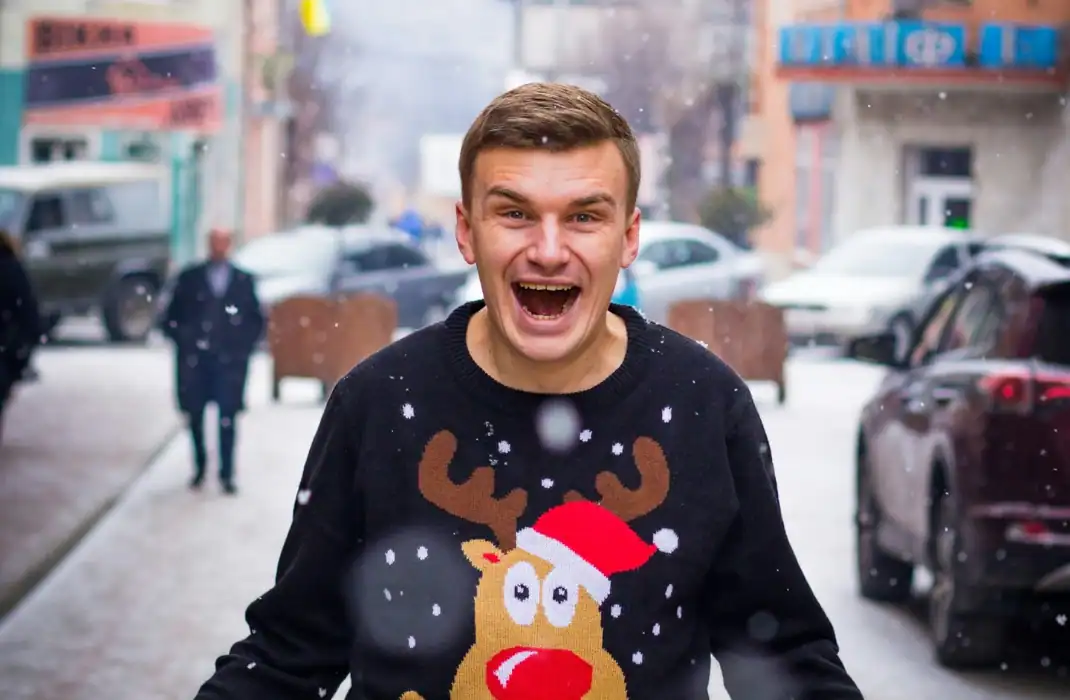 man wearing christmas jumper