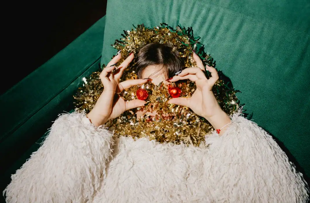 woman posing with christmas decorations